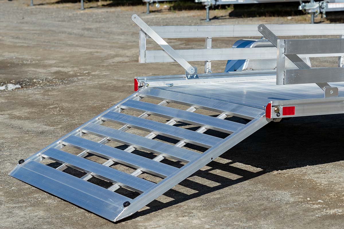A standard integrated rear ramp on an RA 2.0 open aluminum trailer showing beveled edge