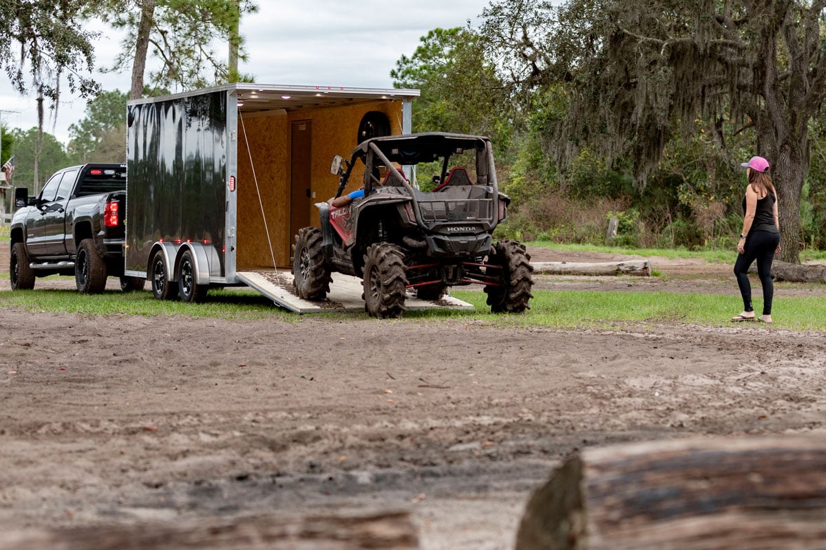 Loading ATVs into an enclosed aluminum trailer in Florida