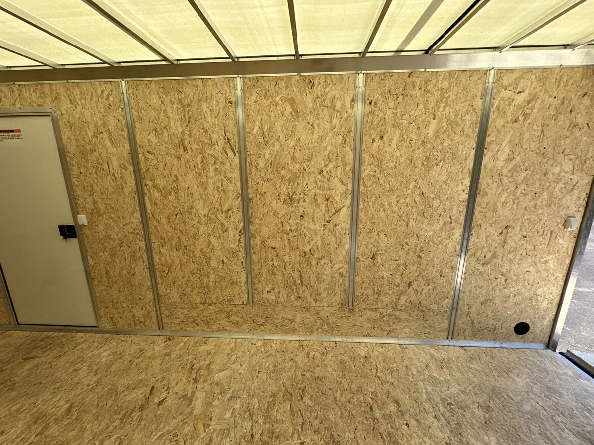 Integrated wall studs and side access door inside trailer