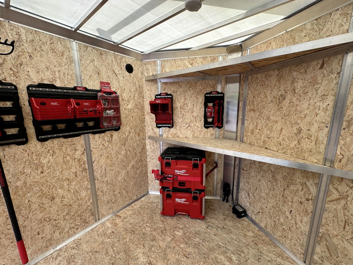 Tool shelves installed in the trailer's V-nose using integrated wall studs as anchor points