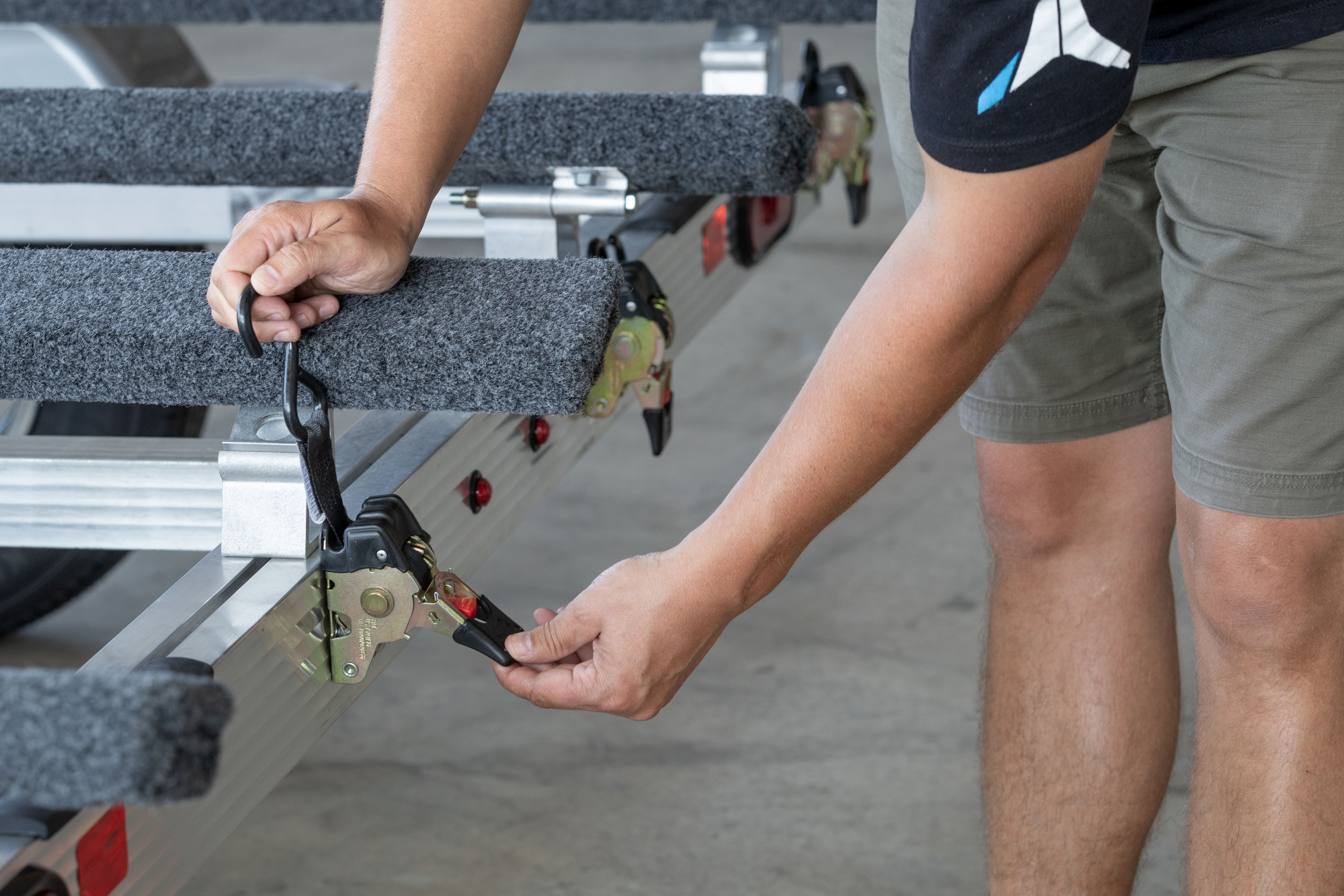 Retractable ratchet straps on a Triton PWC trailer