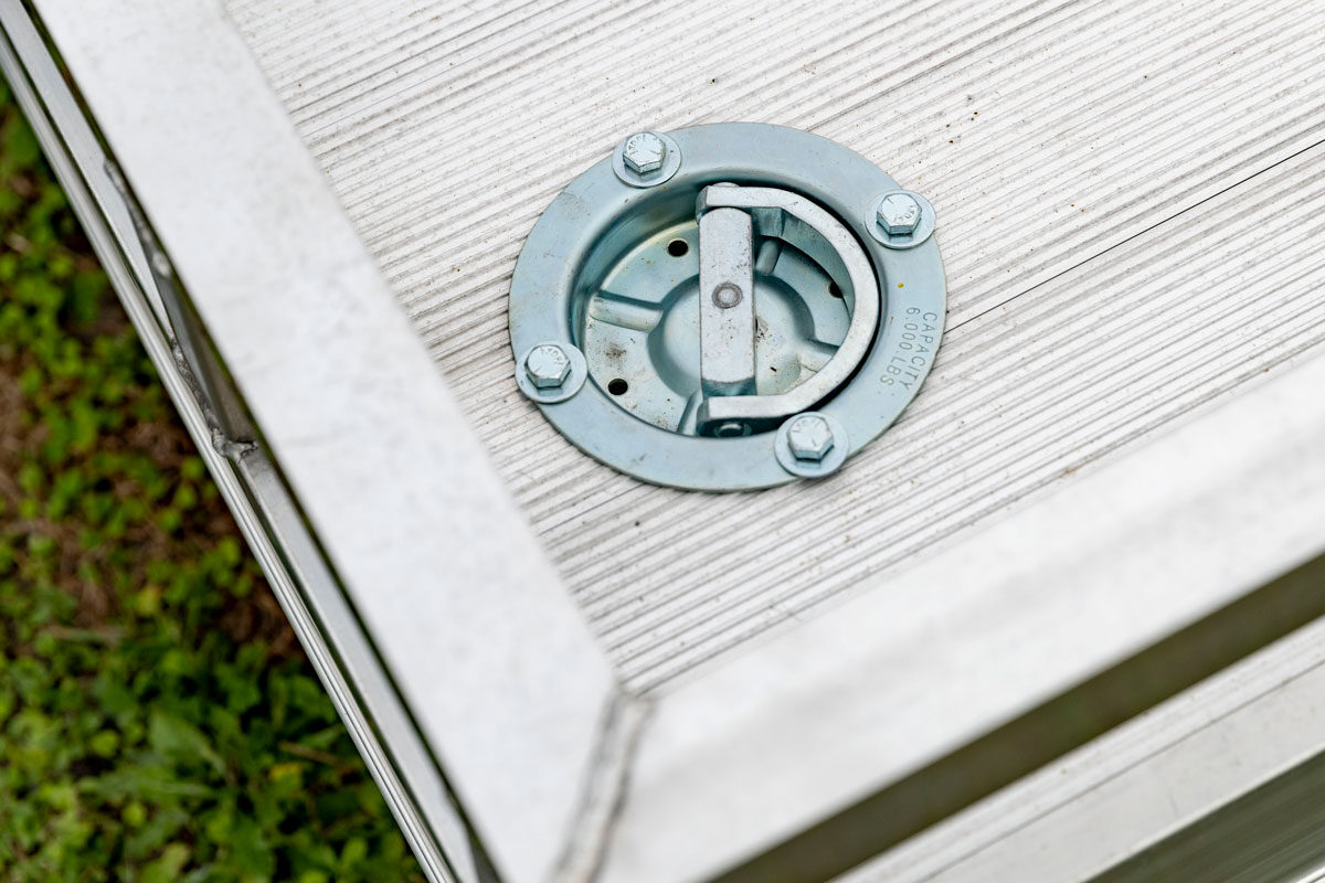 Recessed 6K swivel D-ring installed on an open aluminum utility trailer deck