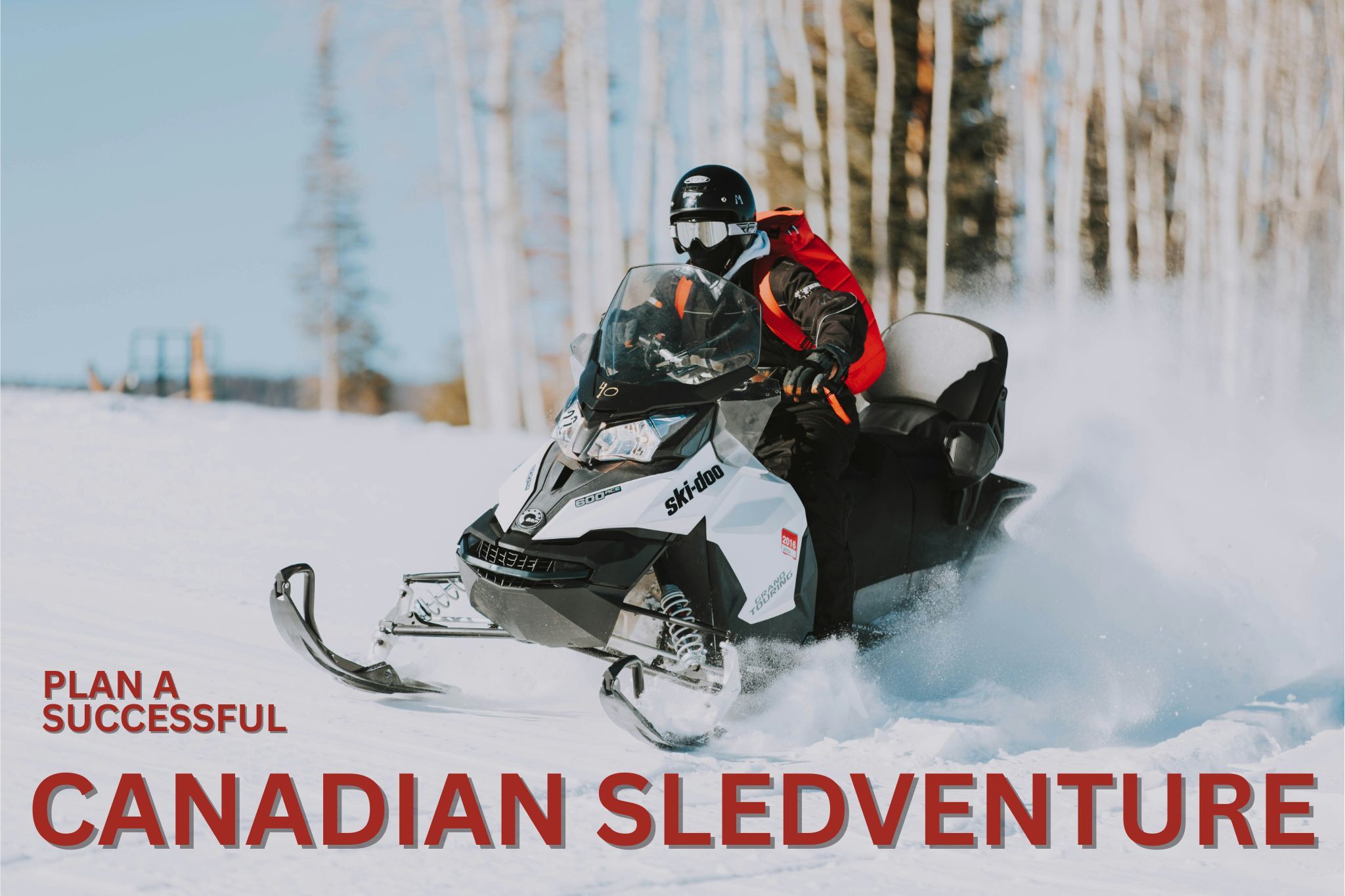 A rider on a snowmobile in a snow-covered field